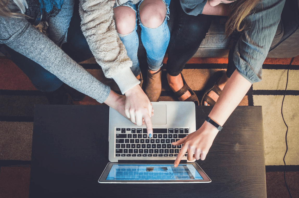 Accountancy opportunities for School leavers. Shot from above of hands pointing at laptop