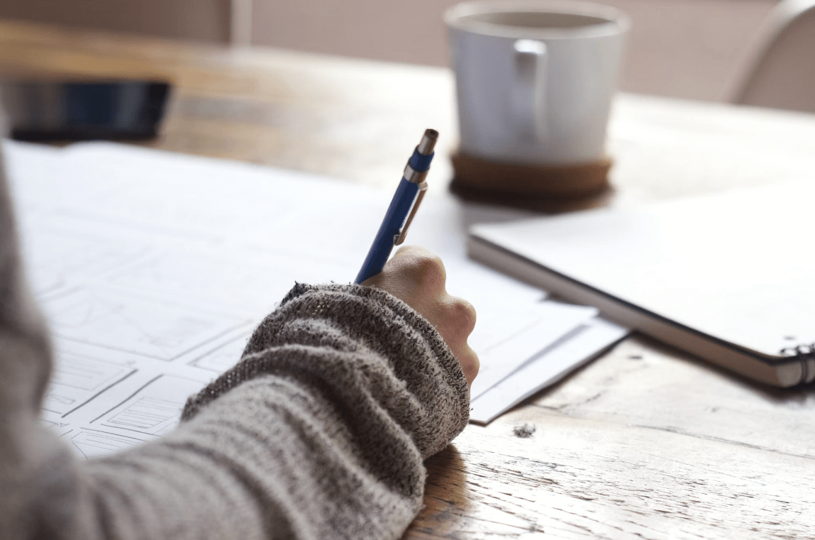 Bevan Buckland Accountants for Small Business. Close up of hand making notes on paper