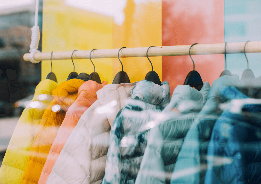 Bevan Buckland Accountants for retail & ecommerce. Colourful puffer coats arranged in a shop window